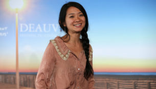 (FILES) In this file photo taken on September 5, 2015 US-Chinese director Chloe Zhao poses during a photocall to present the movie "Songs My Brothers Taught Me" in the French northwestern sea resort of Deauville, during the 41th Deauville US Film Festival. - "Nomadland" made Golden Globes history on February 28, 2021 as Chloe Zhao became the first female director to win the awards' top prize for best drama, putting her film about marginalized Americans roaming the West in vans into Oscars pole position. (Photo by Charly TRIBALLEAU / AFP)