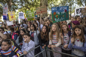 LONDON, ENGLAND - SEPTEMBER 20: Children listen to speakers as they attend the Global Climate Strike on September 20, 2019 in London, England. Millions of people are taking to the streets around the world to take part in protests inspired by the teenage Swedish activist Greta Thunberg. Students are preparing to walk out of lessons in what could be the largest climate protest in history. (Photo by Dan Kitwood/Getty Images)