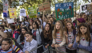 LONDON, ENGLAND - SEPTEMBER 20: Children listen to speakers as they attend the Global Climate Strike on September 20, 2019 in London, England. Millions of people are taking to the streets around the world to take part in protests inspired by the teenage Swedish activist Greta Thunberg. Students are preparing to walk out of lessons in what could be the largest climate protest in history. (Photo by Dan Kitwood/Getty Images)